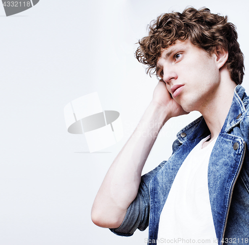 Image of young handsome teenage hipster guy posing emotional, happy smiling against white background isolated, lifestyle people concept