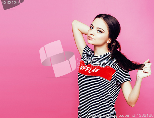 Image of young pretty teenage woman emotional posing on pink background, 