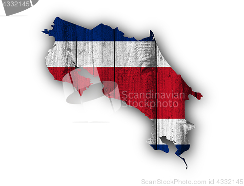 Image of Map and flag of Costa Rica on weathered wood