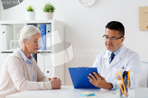 Image of senior woman and doctor meeting at hospital