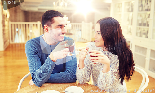Image of happy couple drinking tea at cafe