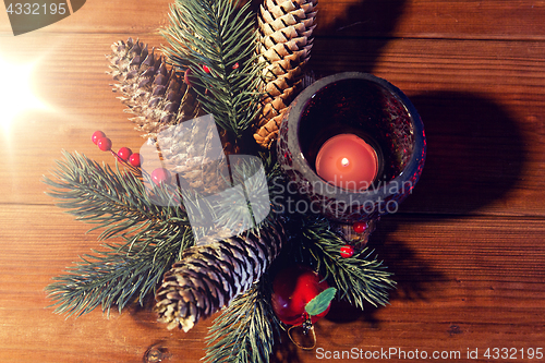 Image of christmas fir branch decoration and candle lantern