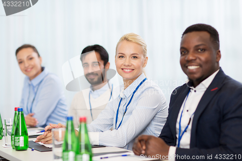 Image of happy business team at international conference