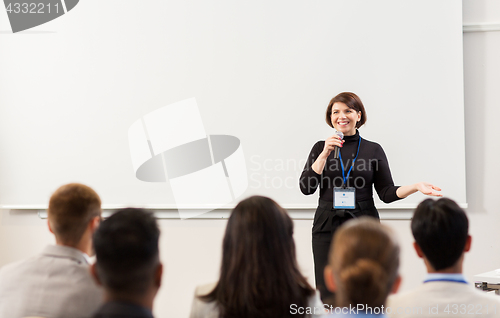 Image of group of people at business conference or lecture