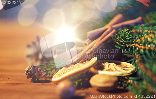 Image of christmas fir branch, cinnamon and dried orange