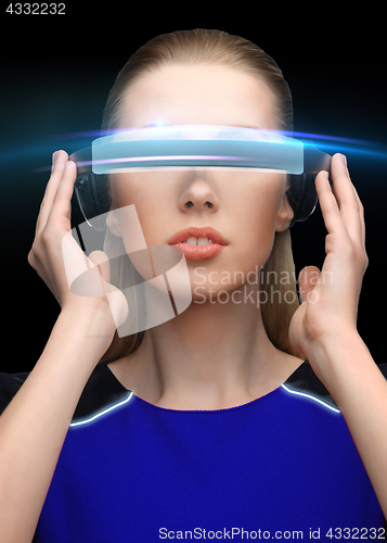 Image of woman in virtual reality 3d glasses over black