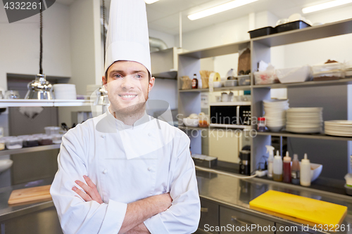 Image of happy male chef cook at restaurant kitchen