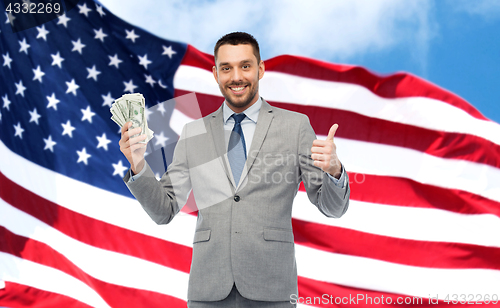 Image of happy businessman with american dollar money