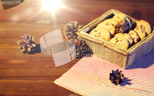 Image of close up of christmas oat cookies on wooden table