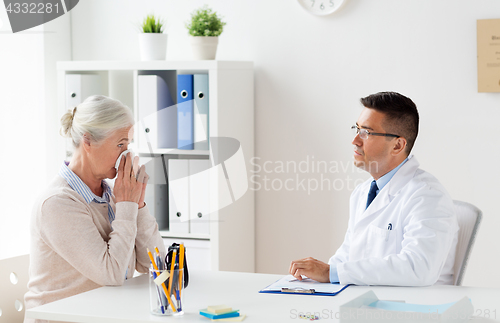 Image of senior woman and doctor meeting at hospital