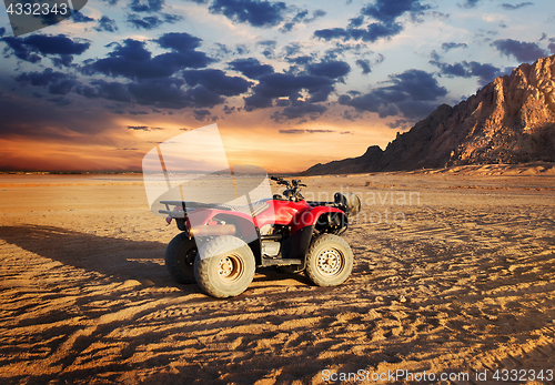 Image of Quad bike in sand desert