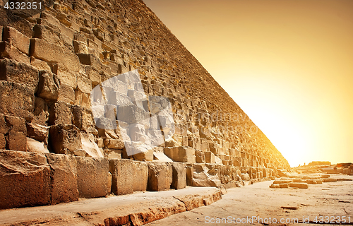 Image of Fiery sunset and pyramid