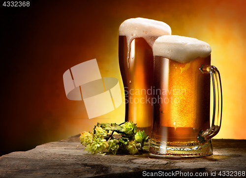 Image of Two glasses of beer and hops