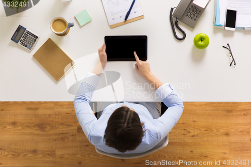 Image of businesswoman with tablet pc at office