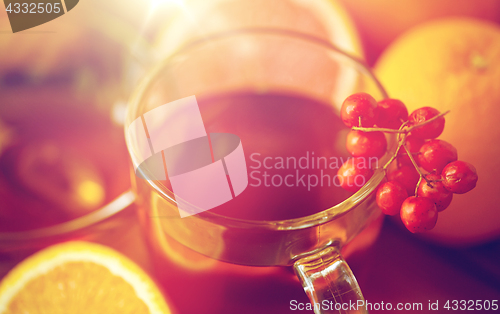 Image of close up of tea cup with rowanberry