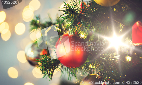 Image of close up of christmas tree decorated with balls