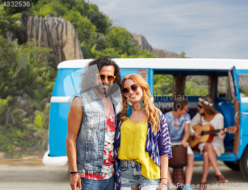 Image of happy hippie couples and minivan on island