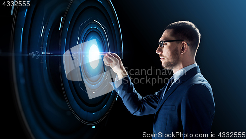 Image of businessman in glasses with virtual projection