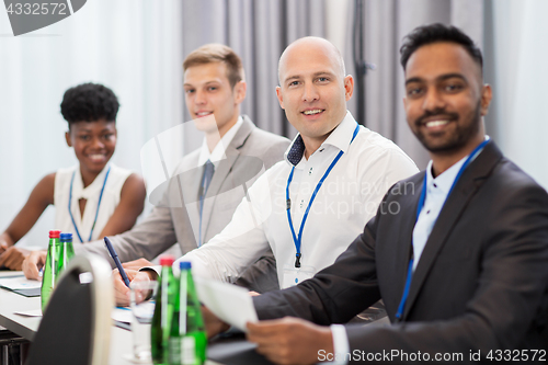 Image of happy business team at international conference