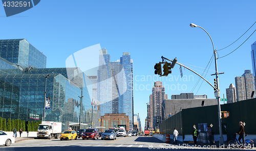 Image of Traffic waits at intersection of 34th Street and 11th Avenue