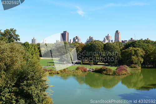 Image of Turtle Pond in Central Park, tourists enjoying a sunny day