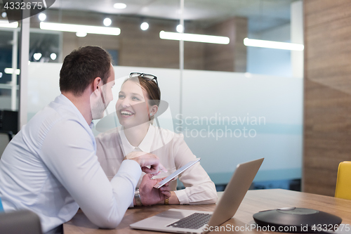 Image of Business People Working With Tablet in startup office