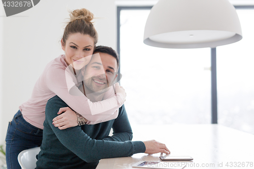 Image of couple hugging in their new home