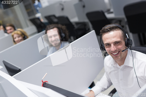 Image of male call centre operator doing his job