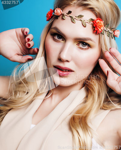 Image of young blond woman dressed like ancient greek godess, gold jewelry close up isolated, beautiful girl hands manicured red nails 