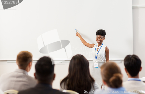 Image of group of people at business conference or lecture