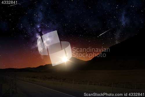 Image of landscape over sunrise in night sky or space