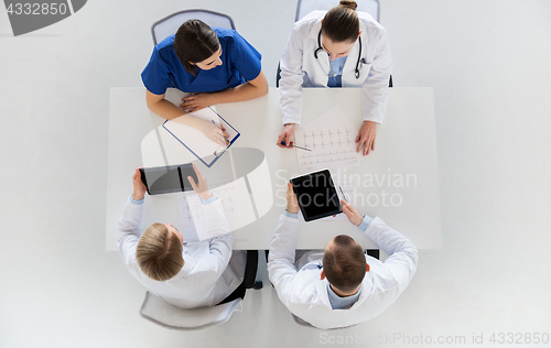 Image of doctors with cardiogram and tablet pc at hospital