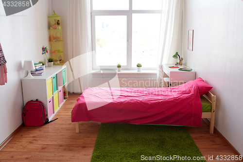 Image of kids room interior with bed, table and accessories