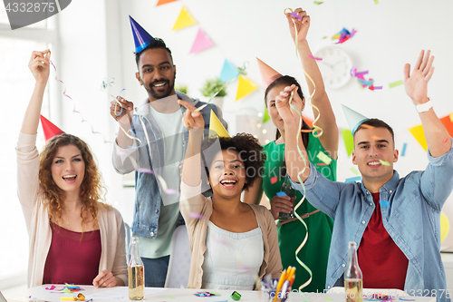 Image of happy team with confetti at office birthday party