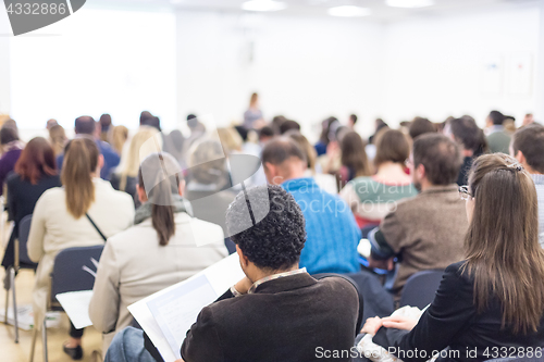 Image of Woman giving presentation on business conference.