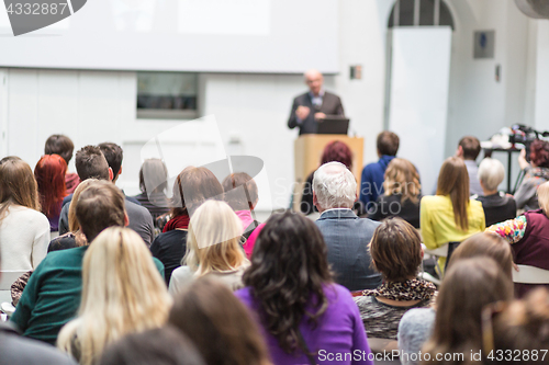 Image of Man giving presentation in lecture hall at university.