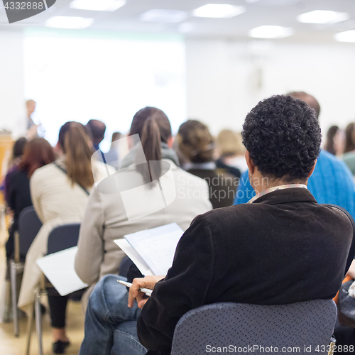 Image of Woman giving presentation on business conference.