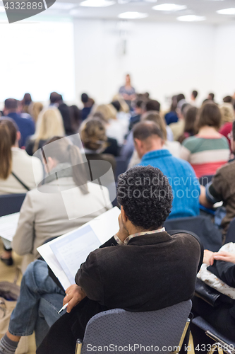 Image of Woman giving presentation on business conference.