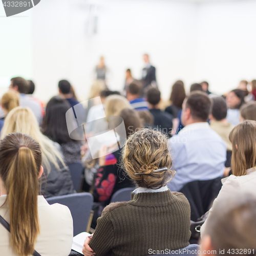 Image of Woman giving presentation on business conference.