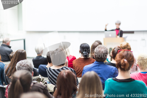 Image of Woman giving presentation on business conference.