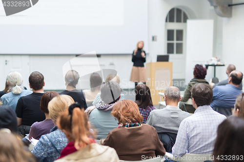 Image of Woman giving presentation on business conference.