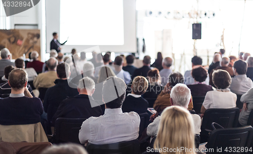 Image of Business speaker giving a talk at business conference event.