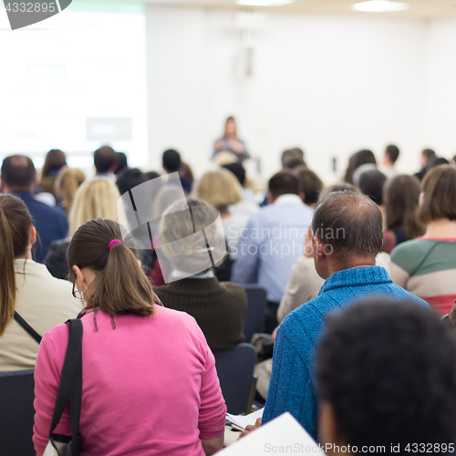 Image of Woman giving presentation on business conference.