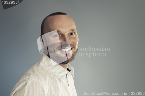 Image of bearded smiling man portrait