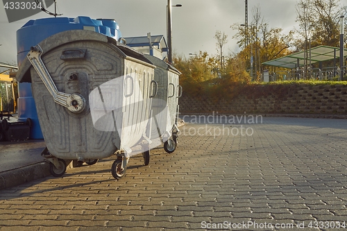 Image of Garbage Containers in a urban area