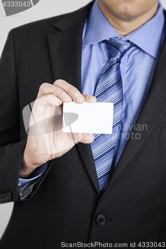 Image of businessman shows his card