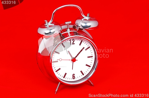 Image of Table clock on red background