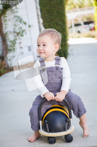 Image of Young Mixed Race Chinese and Caucasian Baby Boy Having Fun Outdo