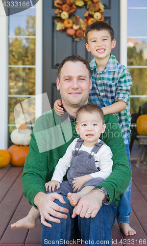 Image of Young Mixed Race Chinese and Caucasian Father with His Sons