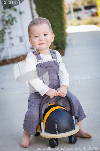 Image of Young Mixed Race Chinese and Caucasian Baby Boy Having Fun Outdo